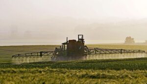 Spraying pesticides on a field