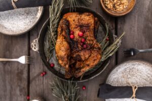 Roasted turkey with rosemary on a wooden table
