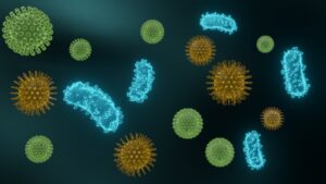 Bacterial cells floating against a dark background