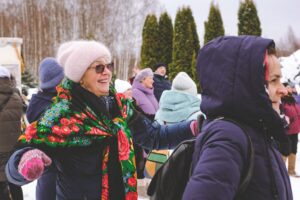 Community members gathering outside in winter